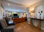 Thumbnail 6 of 45 - a living room filled with furniture and a flat screen tv