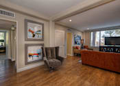 Thumbnail 8 of 45 - a living room filled with furniture and a large window