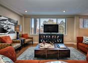 Thumbnail 5 of 45 - a living room with couches and a coffee table