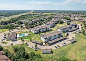 Thumbnail 34 of 36 - an aerial view of an apartment complex with houses and a parking lot
