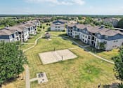 Thumbnail 33 of 36 - an aerial view of a group of houses in a field