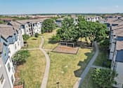 Thumbnail 31 of 36 - an aerial view of a neighborhood with houses and a park