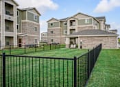 Thumbnail 36 of 39 - an image of an aluminum fence in front of an apartment complex