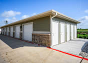 Thumbnail 39 of 39 - a row of garages with white doors