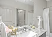Thumbnail 6 of 39 - a bathroom with a sink and a mirror