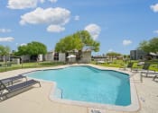 Thumbnail 24 of 41 - our apartments have a resort style pool with lounge chairs