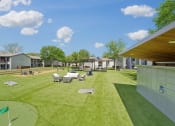 Thumbnail 33 of 41 - a backyard with tables and chairs on a grass field