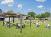 Thumbnail 27 of 41 - a rendering of a picnic area with tables and chairs on the grass