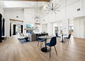 Thumbnail 21 of 38 - a communal area with a dining table and chairs and a living room