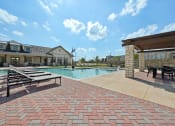 Thumbnail 36 of 38 - the preserve at ballantyne commons pool and resort style buildings with picnic tables and
