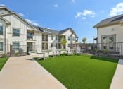 Thumbnail 33 of 38 - the preserve at ballantyne commons courtyard with lawn chairs and buildings