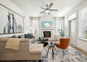 Thumbnail 1 of 38 - a living room with a couch and a ceiling fan