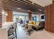Thumbnail 34 of 55 - A modern clubroom with plenty of seating.