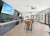 Thumbnail 9 of 21 - the preserve has a dining room table and a kitchen