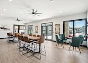 Thumbnail 10 of 21 - the reserve at city center spacious dining room with table and chairs and windows
