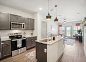 Thumbnail 4 of 21 - a kitchen with stainless steel appliances and a counter top