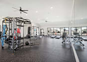 Thumbnail 12 of 21 - the preserve at ballantyne commons fitness room with weights and equipment