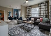 Thumbnail 14 of 50 - a living room with a couch chairs and a coffee table in front of a window