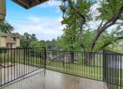 Thumbnail 15 of 23 - the preserve at ballantyne commons balcony guard rail with trees and a river