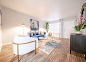 Thumbnail 11 of 47 - our apartments offer a living room with a couch and a coffee table