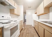Thumbnail 17 of 47 - the preserve at ballantyne commons apartment kitchen with stove and sink