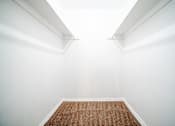 Thumbnail 16 of 47 - a empty room with white walls and a carpet