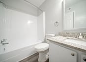 Thumbnail 26 of 47 - an empty bathroom with a toilet and a sink