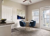 Thumbnail 3 of 24 - a dining room with a round table and blue chairs