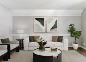 Thumbnail 1 of 30 - a living room with a white couch and a coffee table