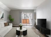 Thumbnail 2 of 30 - a living room with a white couch and a coffee table and a television