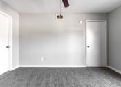 Thumbnail 24 of 30 - an empty room with carpet and a white door