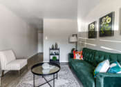 Thumbnail 30 of 30 - a living room with a green couch and a coffee table