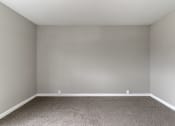 Thumbnail 28 of 31 - an empty room with carpet and white walls
