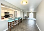 Thumbnail 14 of 31 - our apartments offer a kitchen and living room  at The Alara, Texas