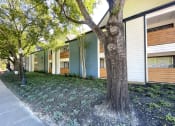 Thumbnail 16 of 30 - a row of apartment buildings with trees in front of them  at 2151 Kirkwood, Houston, TX