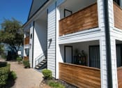 Thumbnail 15 of 30 - a view of the side of a house with a wooden facade  at 2151 Kirkwood, Houston