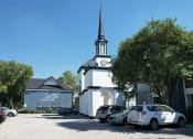 Thumbnail 12 of 30 - a white church with a tall steeple and a clock tower  at 2151 Kirkwood, Houston, Texas