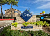 Thumbnail 22 of 31 - a sign that says the alara condominiums with a building in the background  at The Alara, Houston, 77060