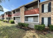 Thumbnail 21 of 31 - a row of apartment buildings with a grassy area in front of them  at The Alara, Texas