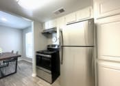 Thumbnail 22 of 30 - a kitchen and dining area in a 555 waverly unit  at 2151 Kirkwood, Houston