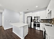 Thumbnail 2 of 7 - Kitchen with stainless steel appliances at The Aurea Apartments, Texas, 77093