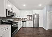 Thumbnail 3 of 7 - Modern kitchen with stainless steel appliances1 at The Aurea Apartments, Houston, TX