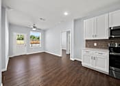 Thumbnail 4 of 7 - Modern kitchen and dining area with hardwood floors at The Aurea Apartments, Houston, 77093