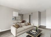 Thumbnail 6 of 31 - A living room with a white couch and a coffee table.