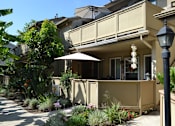 Thumbnail 4 of 5 - A house with a balcony and a lamp post.