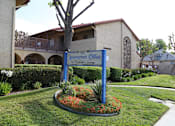 Thumbnail 2 of 37 - A sign for Arrowcrest Olive reads "1400 S. Orange Ave, Garden Grove.".