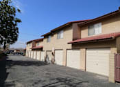 Thumbnail 20 of 37 - A row of houses with garages on the side.
