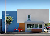 Thumbnail 17 of 77 - A modern building with a blue and white exterior and a red object in front.