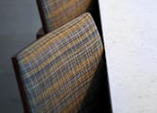 Thumbnail 62 of 77 - A row of brown plaid chairs are lined up against a white wall.
