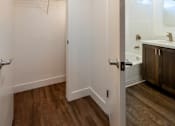 Thumbnail 15 of 37 - A white door is open to a bathroom.